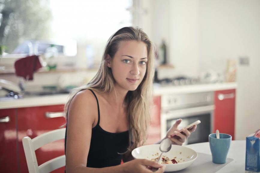 woman-in-black-tank-top-eating-oatmeal-3769722