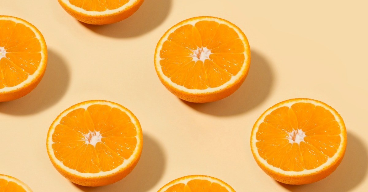 orange-fruit-pattern-on-yellow-background-picture-id1171146331-1