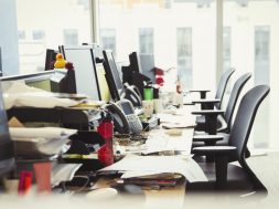 Messy row of desks in office