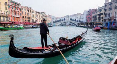 A gondola is pictured on Grand Canal in front of Rialto bridge in Venice
