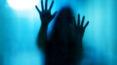 48188061 – abstract woman behind the matte glass. blurry hand and body figure