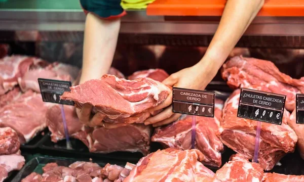 depositphotos_223600664-stock-photo-closeup-female-butcher-hands-holding