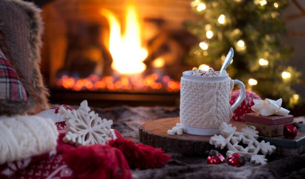Christmas cozy hot chocolate in front of the fireplace