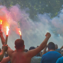 Football fans go to the stadium and burn the firecrackers