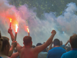 Football fans go to the stadium and burn the firecrackers
