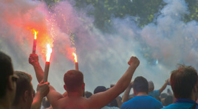 Football fans go to the stadium and burn the firecrackers