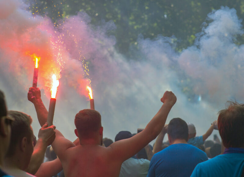 Football fans go to the stadium and burn the firecrackers