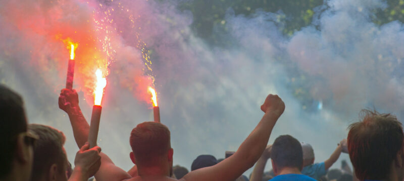 Football fans go to the stadium and burn the firecrackers