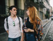 Two friends talking in the street