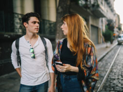 Two friends talking in the street