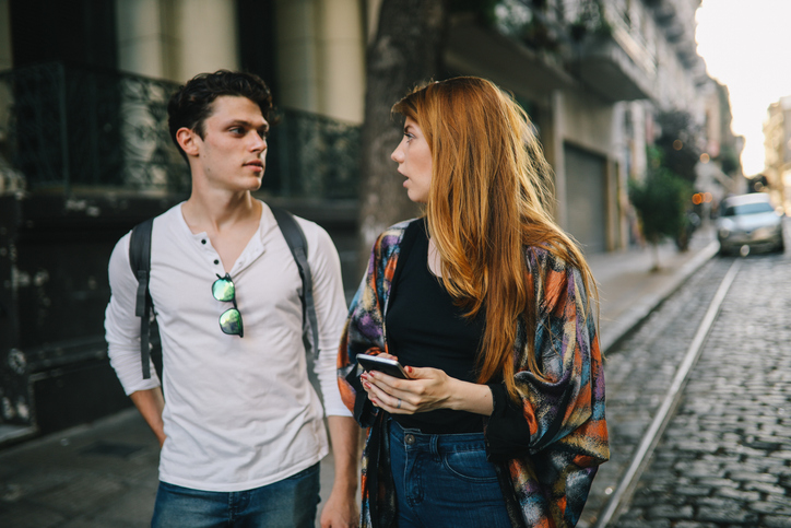 Two friends talking in the street