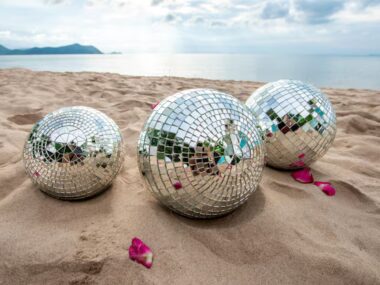 disco-ball-sand-view-from-beach-party_397170-1660