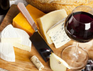 Red,Wine,And,Assorted,Cheese,Plate,With,Fruit
