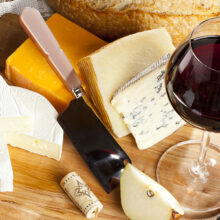 Red,Wine,And,Assorted,Cheese,Plate,With,Fruit
