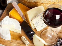 Red,Wine,And,Assorted,Cheese,Plate,With,Fruit