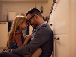 Affectionate,Father,And,Daughter,Sitting,Face,To,Face,While,Relaxing