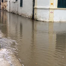 rain_flooded_shuttered_street