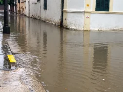 rain_flooded_shuttered_street